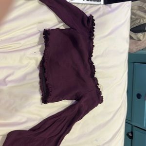 Maroon off the shoulder ribbed top with flare sleeves.